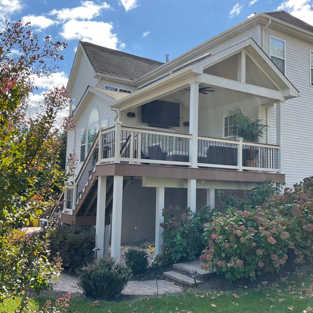 Covered porch and balcony remodel - Skyline Exteriors - Skyline Exteriors Two-story home with new covered porch and second-floor balcony