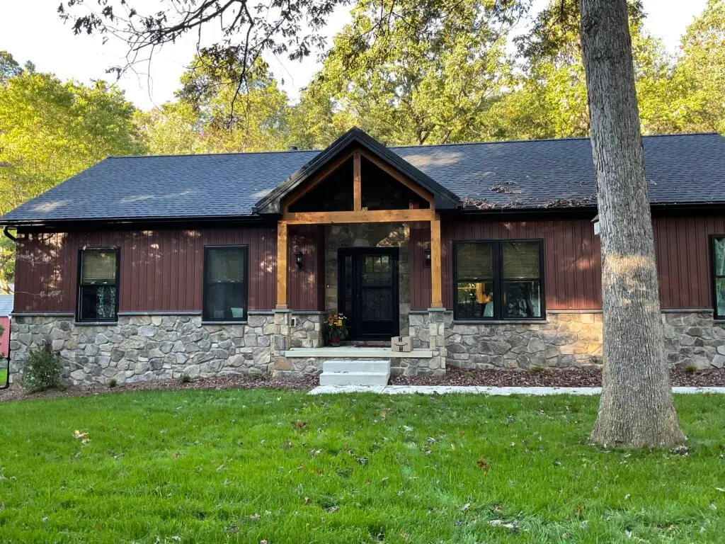 Stone and board-and-batten ranch remodel - Skyline Exteriors - Skyline Exteriors Ranch home with stone veneer, board-and-batten siding and timber-frame entry