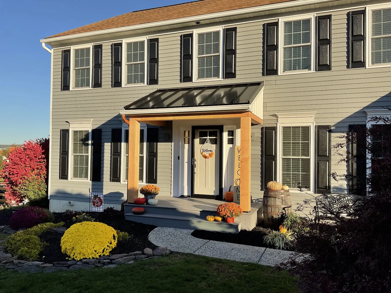 custom-front-porch-built-in-west-chester - Skyline Exteriors - Skyline Exteriors An updated front porch with wood columns by an exterior remodeler in Radnor Township, PA.