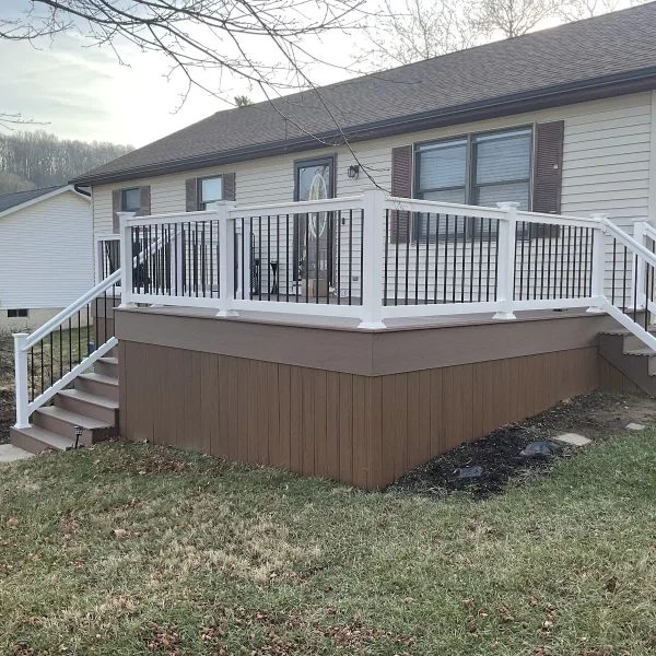 A custom composite deck with white railings built by an exterior remodeler in Radnor Township, PA.